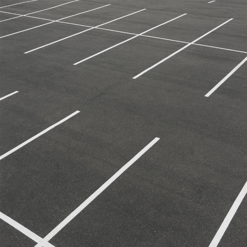 Parking lot showing evenly spaced painted parking lines